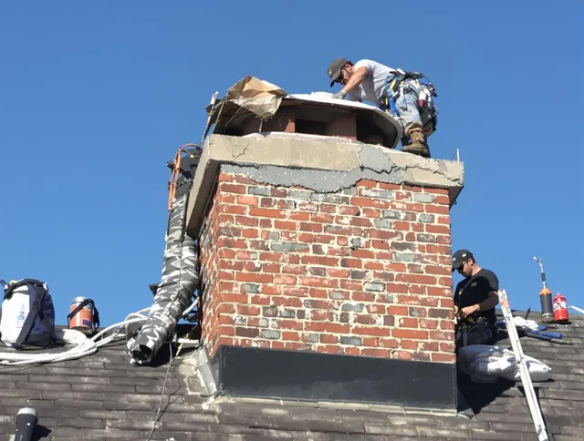 Baldwin Park Chimney Sweep installing a custom chimney crown in Baldwin Park, CA